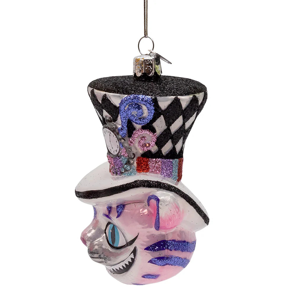 Side view of Cheshire Cat handmade glass ornament showing striped pattern and smiling face.