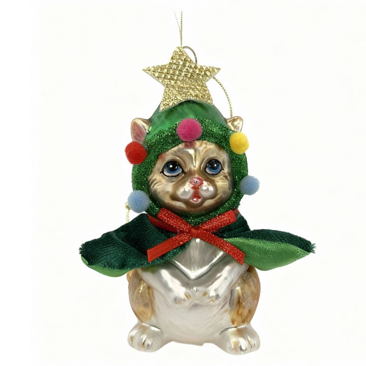 Handcrafted glass Christmas ornament featuring a golden cat wearing a green Christmas tree cape with gold star topper and colorful pompoms
