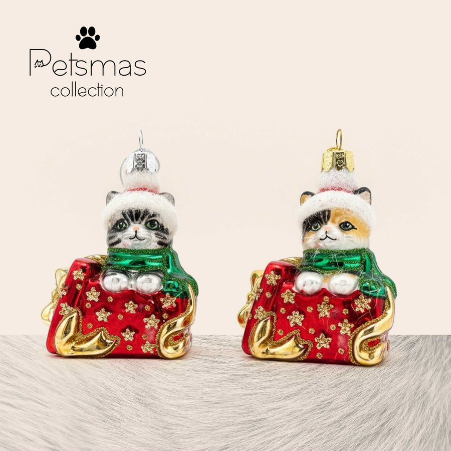 Handcrafted glass Christmas ornament featuring kitten in gift box by Edmo - artisan holiday decoration