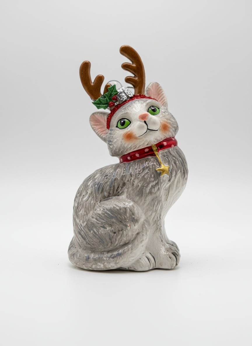 Gray kitten with reindeer antlers handmade glass ornament, part of Edmo Christmas collection.