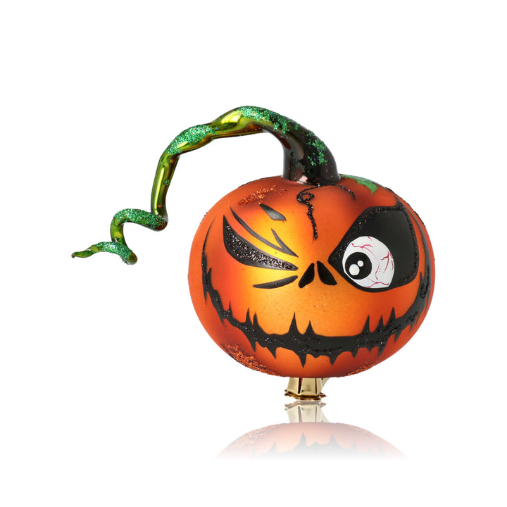 Handcrafted orange glass Halloween pumpkin ornament featuring a scary smiling face, made by skilled Polish artisans.