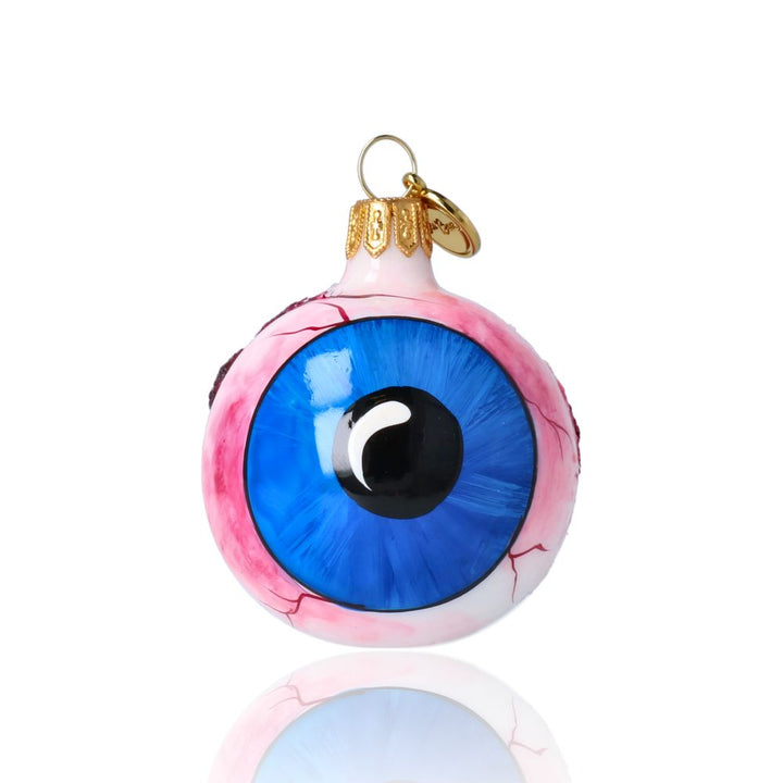 Front view of handmade glass eyeball ornament featuring a vivid blue iris, crafted by Polish artisans for Halloween décor.