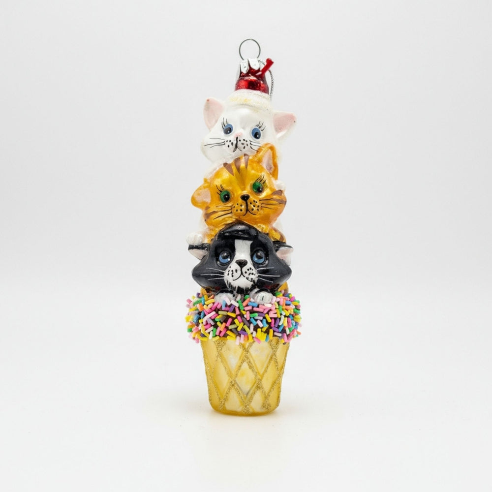 Front view of the three kittens stacked on an ice cream cone handmade glass ornament.