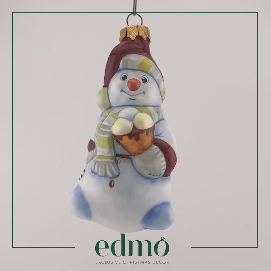 Video of glass christmas ornament of snowman with ice cream