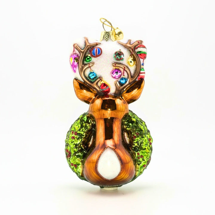 Traditional Christmas wreath glass ornament with back of reindeer head.