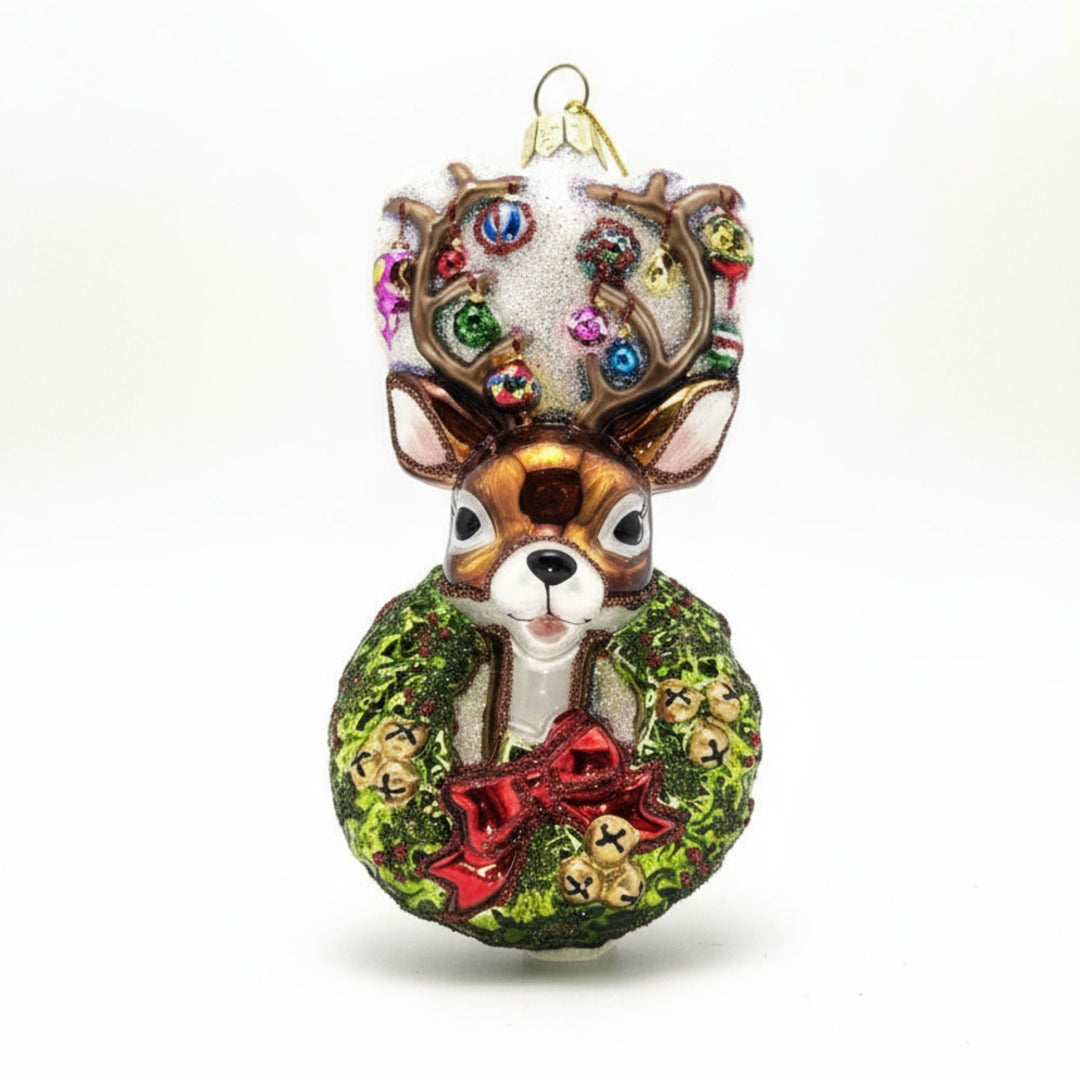 Traditional Christmas wreath glass ornament with reindeer head.
