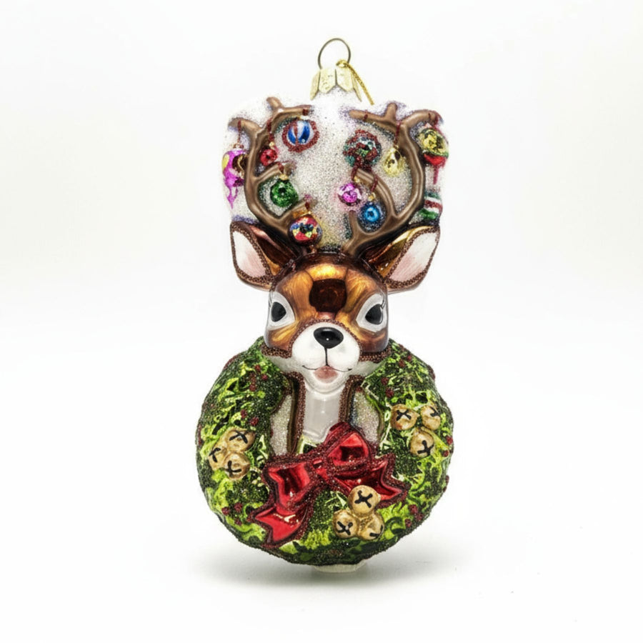 Traditional Christmas wreath glass ornament with reindeer head.