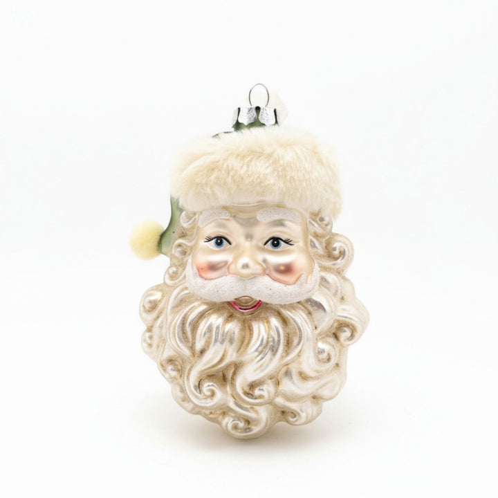 Handcrafted glass ornament of Santa Claus head with green hat and fur-trim detail.