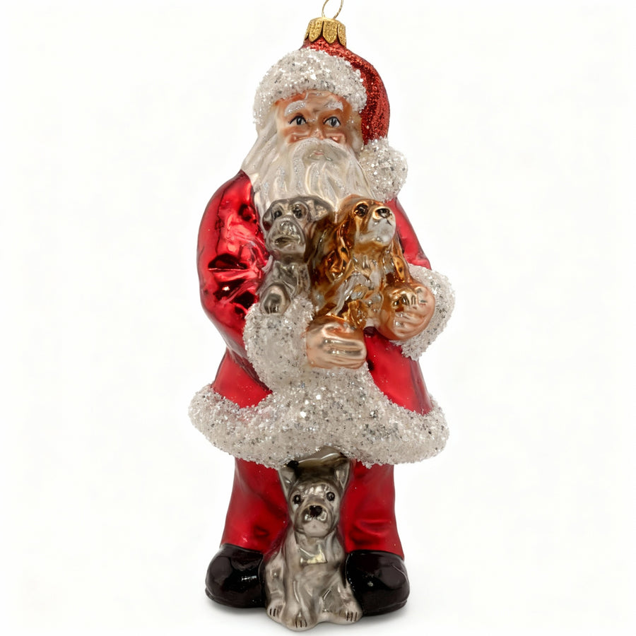 European artisan Christmas glass ornament depicting Santa Claus with adorable puppies, red suit, and sparkling details.