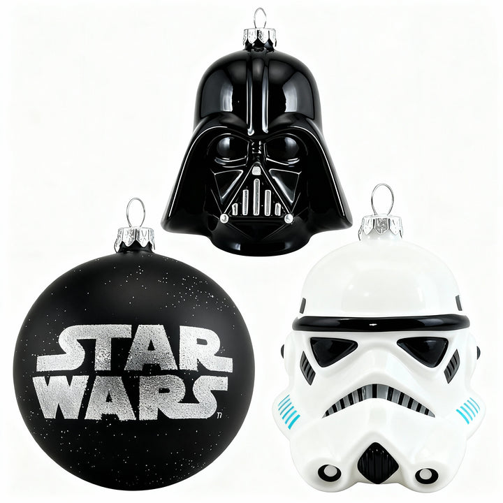 Cozy festive holiday setting featuring three Star Wars glass Christmas ornaments: Darth Vader helmet, Imperial Guard helmet, and black sphere with Star Wars logo, perfect for exclusive Christmas decor by edmodecor.com