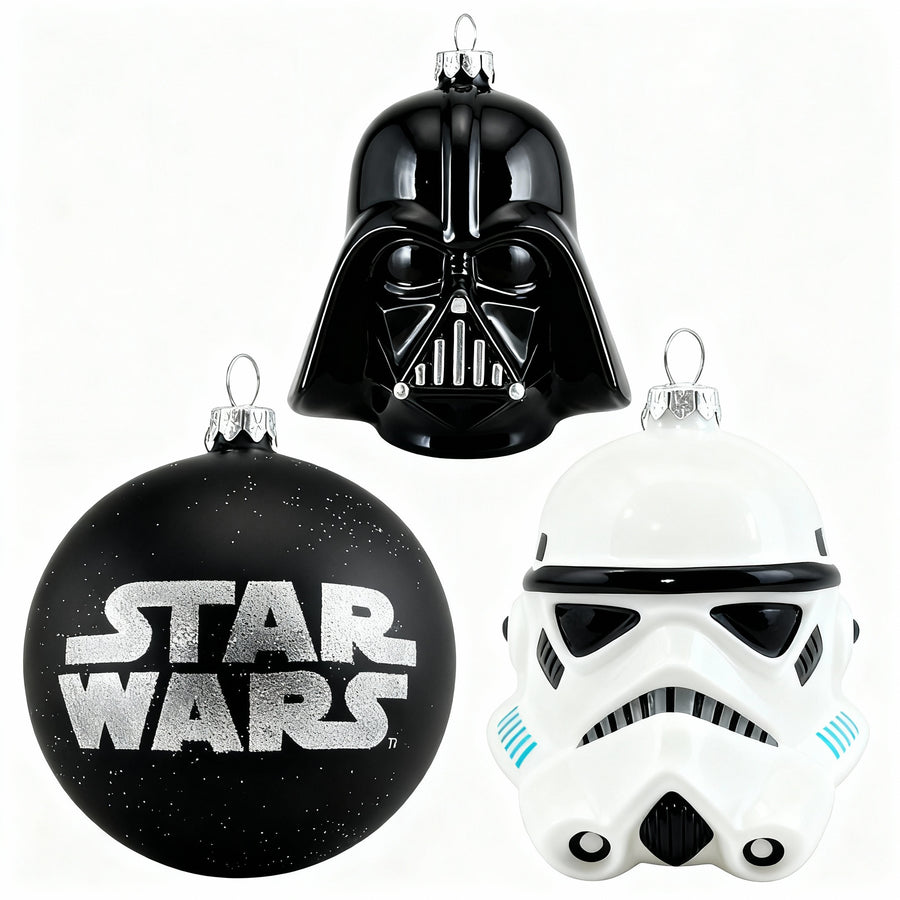 Cozy festive holiday setting featuring three Star Wars glass Christmas ornaments: Darth Vader helmet, Imperial Guard helmet, and black sphere with Star Wars logo, perfect for exclusive Christmas decor by edmodecor.com