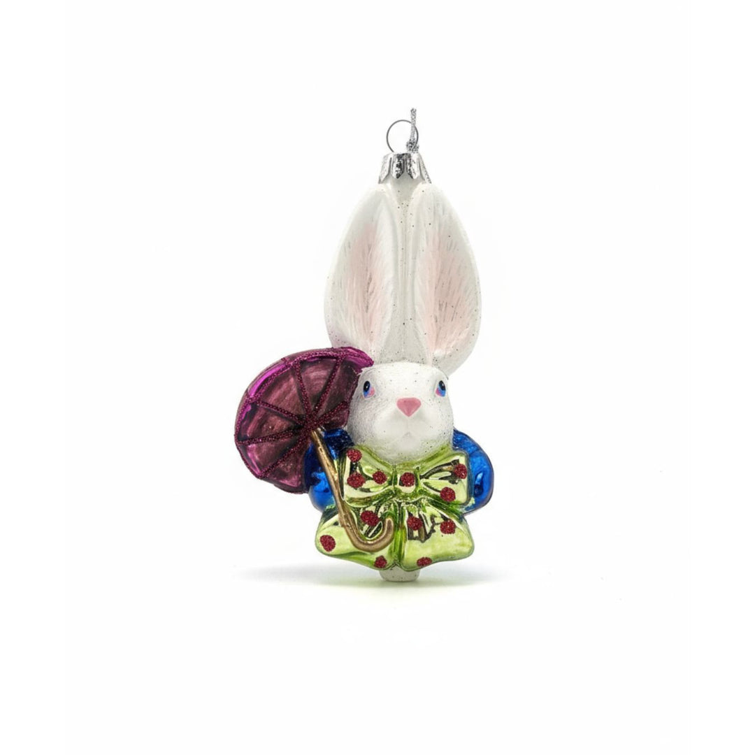 Front view of the White Rabbit hand-blown glass ornament head with classic red jacket detail.
